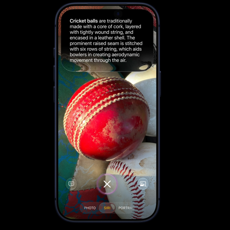 An iPhone screen displaying the iOS 27 Camera app in Siri mode, focused on a red cricket ball. An augmented reality text overlay at the top provides a detailed explanation of a cricket ball's materials and construction.