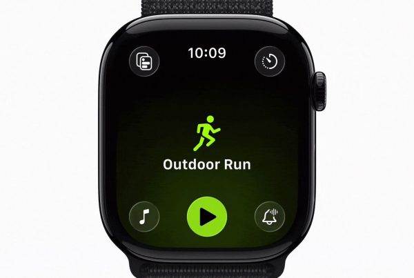 An Apple Watch screen displaying the "Outdoor Run" start page within the watchOS 27 Workout app, featuring a neon green runner silhouette and a central play button.