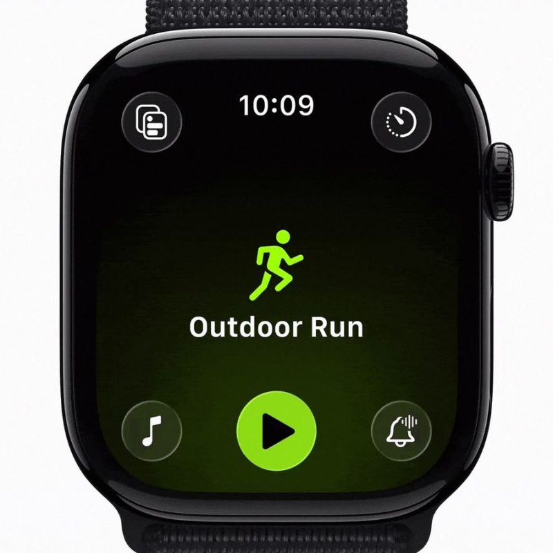 An Apple Watch screen displaying the "Outdoor Run" start page within the watchOS 27 Workout app, featuring a neon green runner silhouette and a central play button.